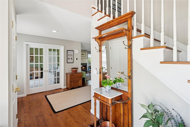 entrance foyer featuring recessed lighting, french doors, stairs, and wood finished floors