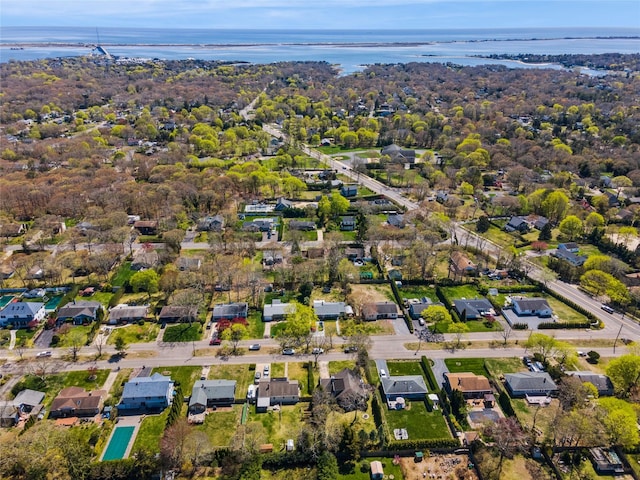 bird's eye view featuring a residential view and a water view
