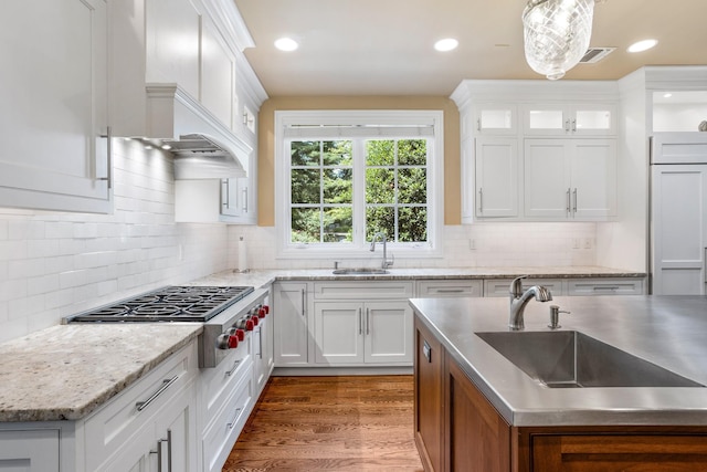 9 Earle Dr, Muttontown, NY 11791 - kitchen featuring stainless steel gas stovetop, white cabinetry, tasteful backsplash, dark wood-style flooring, and recessed lighting