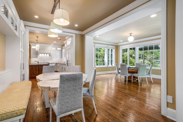 9 Earle Dr, Muttontown, NY 11791 - dining area with crown molding, dark wood-type flooring, recessed lighting, and a chandelier