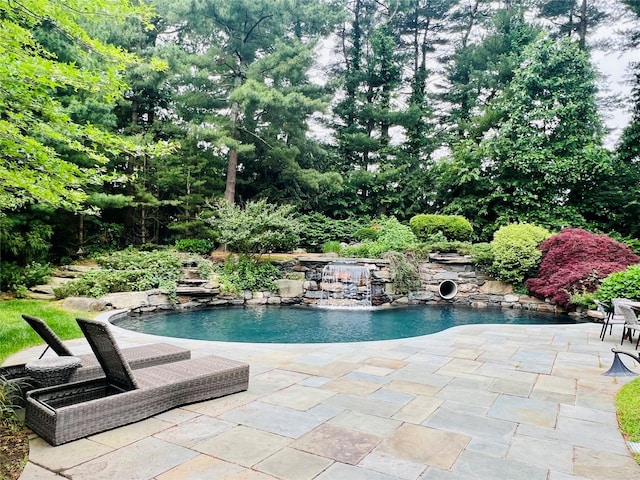 9 Earle Dr, Muttontown, NY 11791 - swimming pool with a patio and view of scattered trees