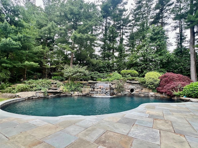 9 Earle Dr, Muttontown, NY 11791 - swimming pool featuring a patio and view of wooded area
