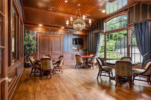 9 Earle Dr, Muttontown, NY 11791 - dining room featuring a decorative wall, wooden ceiling, a chandelier, wood finished floors, and lofted ceiling