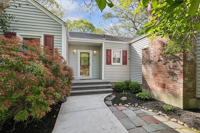 22 Washington Dr, Centerport, NY 11721 - property entrance featuring roof with shingles