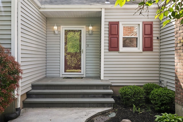 22 Washington Dr, Centerport, NY 11721 - view of exterior entry featuring roof with shingles