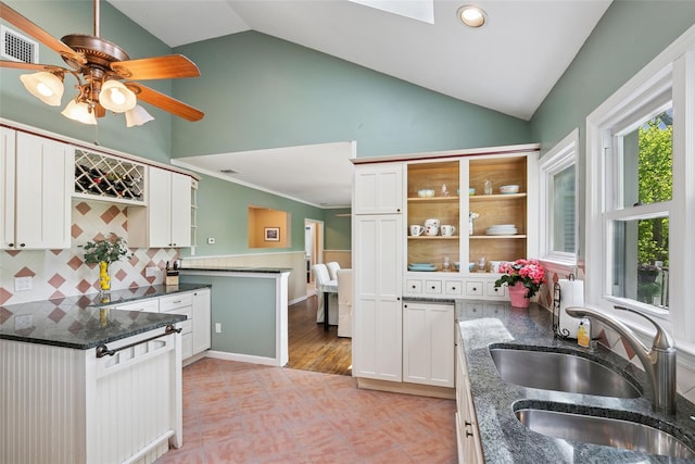 22 Washington Dr, Centerport, NY 11721 - kitchen featuring a sink, a peninsula, white cabinetry, decorative backsplash, and a ceiling fan