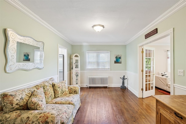 22 Washington Dr, Centerport, NY 11721 - living room featuring radiator heating unit, ornamental molding, and dark wood-type flooring
