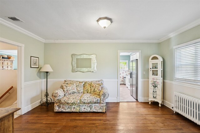 22 Washington Dr, Centerport, NY 11721 - sitting room featuring radiator heating unit, wood finished floors, crown molding, and baseboards