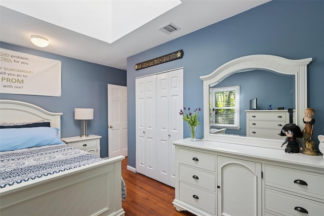 22 Washington Dr, Centerport, NY 11721 - bedroom with dark wood-style flooring, a closet, and a skylight