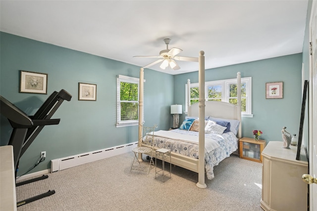 22 Washington Dr, Centerport, NY 11721 - carpeted bedroom featuring a baseboard heating unit, a ceiling fan, and baseboards