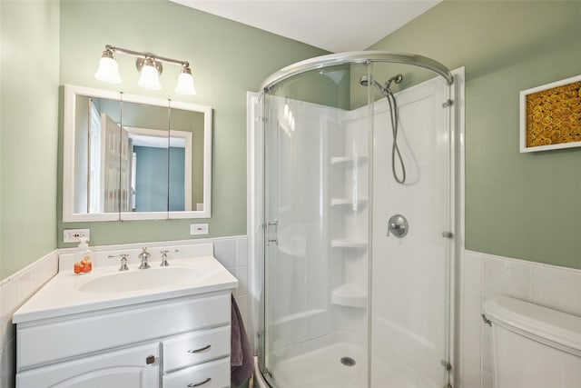 22 Washington Dr, Centerport, NY 11721 - bathroom with tile walls, a shower stall, wainscoting, vanity, and toilet