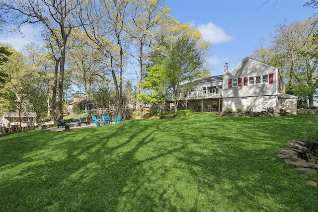 22 Washington Dr, Centerport, NY 11721 - view of green lawn featuring a wooden deck and a patio