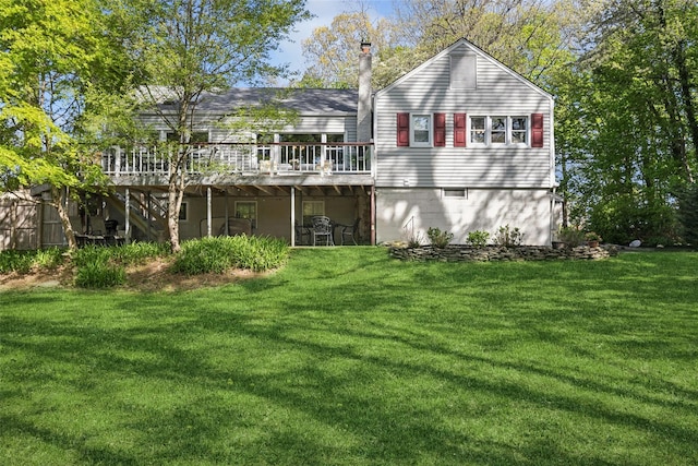 22 Washington Dr, Centerport, NY 11721 - rear view of house featuring a deck and a yard