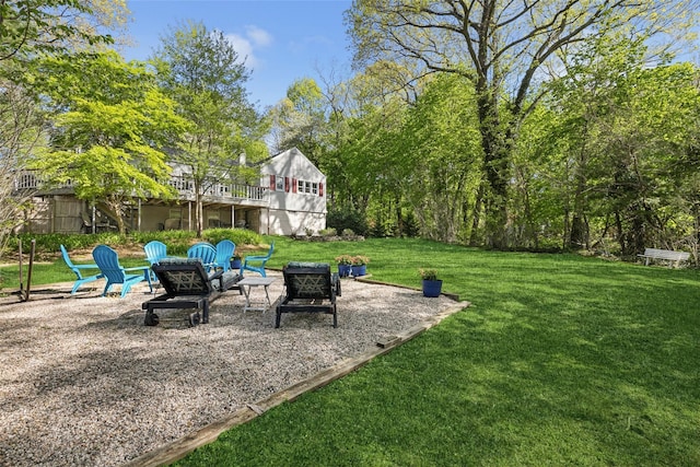 22 Washington Dr, Centerport, NY 11721 - view of grassy yard featuring an outdoor fire pit and a patio area