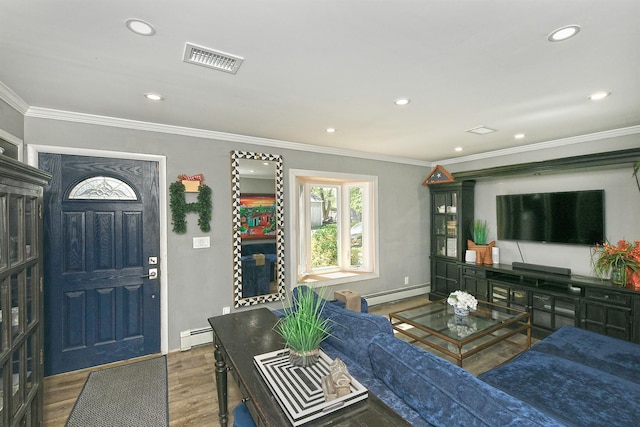 living area featuring visible vents, recessed lighting, a baseboard heating unit, and wood finished floors