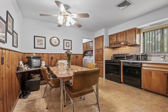 2 Yorktown Rd, Dix Hills, NY 11746 - dining area with ceiling fan, visible vents, washing machine and clothes dryer, wood walls, and a wainscoted wall