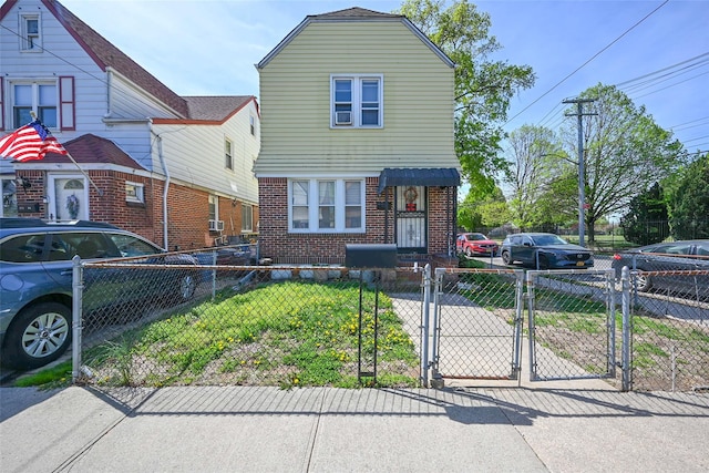 171-02 Courtney Ave, Flushing, NY 11358 - view of front of home featuring a gate, a fenced front yard, and brick siding