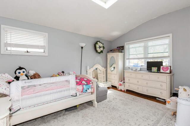 bedroom featuring vaulted ceiling and wood finished floors