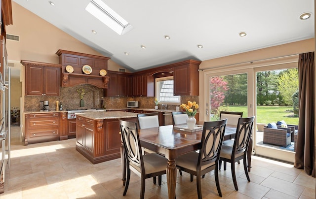 dining area featuring vaulted ceiling with skylight, recessed lighting, and visible vents