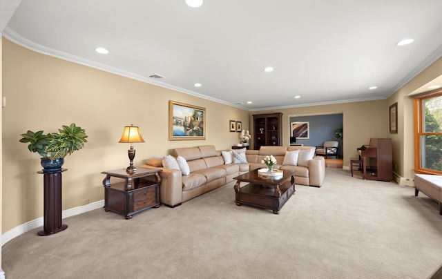 living area with crown molding, recessed lighting, and light colored carpet