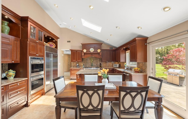 dining room featuring recessed lighting, visible vents, and vaulted ceiling with skylight