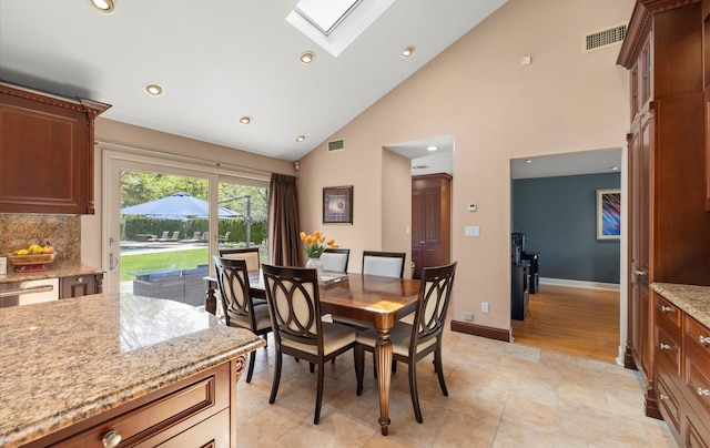 dining area featuring a skylight, high vaulted ceiling, recessed lighting, and visible vents