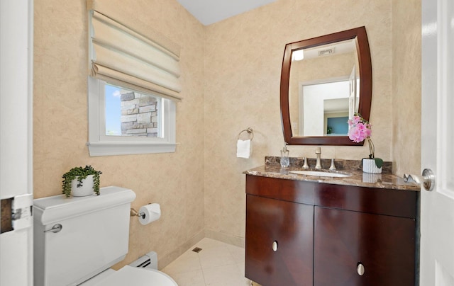 half bathroom featuring visible vents, vanity, a baseboard radiator, tile patterned floors, and toilet