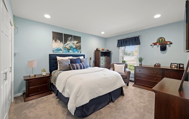bedroom featuring recessed lighting, light colored carpet, and baseboard heating
