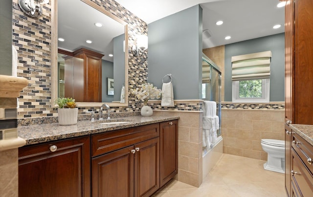full bath with vanity, tile patterned flooring, toilet, tile walls, and recessed lighting