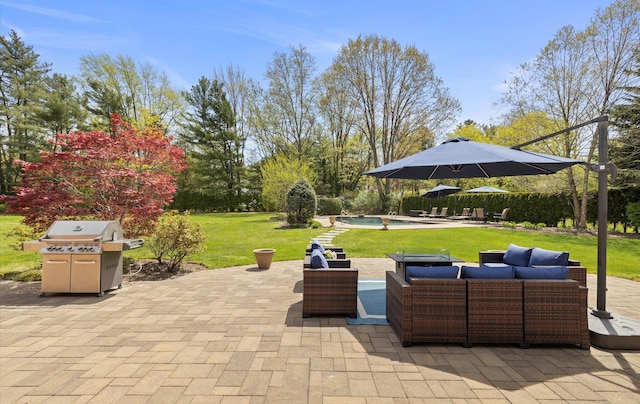 view of patio featuring an outdoor pool, grilling area, and an outdoor hangout area