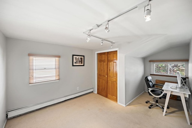 office area with light colored carpet, track lighting, baseboard heating, baseboards, and lofted ceiling