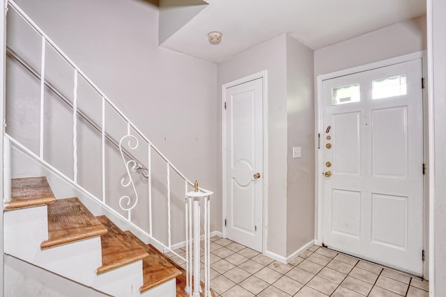 7 Macintosh Ln, Monsey, NY 10952 - foyer entrance with baseboards, stairs, and light tile patterned flooring