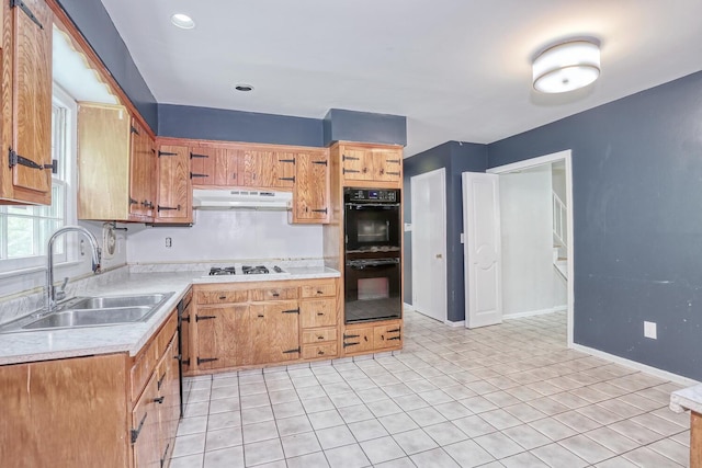 7 Macintosh Ln, Monsey, NY 10952 - kitchen featuring dobule oven black, a sink, light countertops, white gas cooktop, and under cabinet range hood