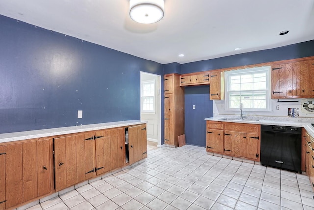 7 Macintosh Ln, Monsey, NY 10952 - kitchen featuring a sink, light countertops, brown cabinetry, and dishwasher