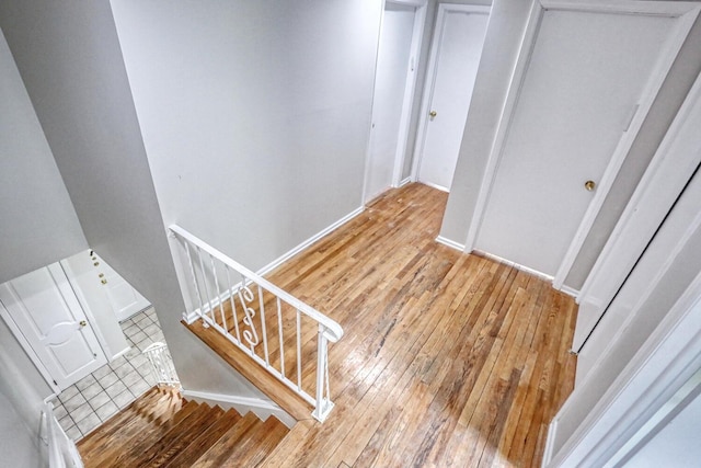 7 Macintosh Ln, Monsey, NY 10952 - stairway with baseboards and hardwood / wood-style floors