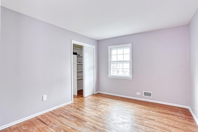 7 Macintosh Ln, Monsey, NY 10952 - unfurnished bedroom with visible vents, light wood-style flooring, baseboards, and a closet