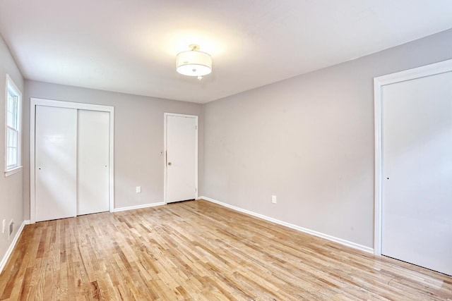 7 Macintosh Ln, Monsey, NY 10952 - unfurnished bedroom with baseboards and light wood-style flooring
