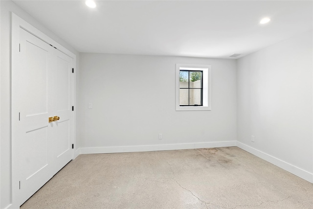 unfurnished bedroom featuring baseboards and recessed lighting