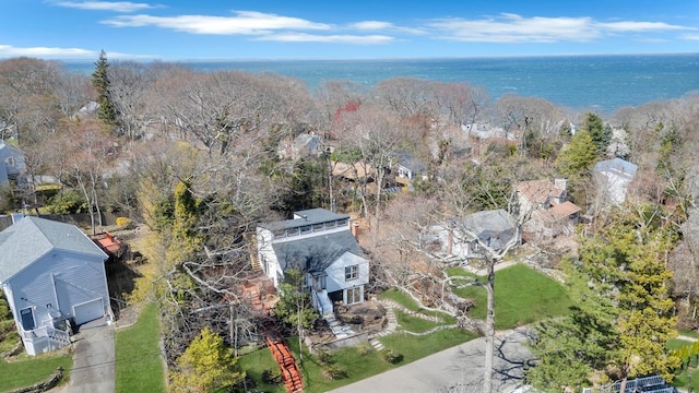 bird's eye view featuring a water view and a residential view