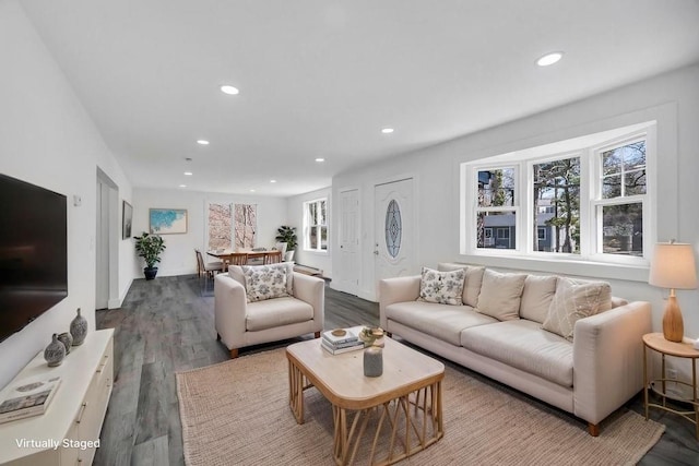 living area with recessed lighting and wood finished floors