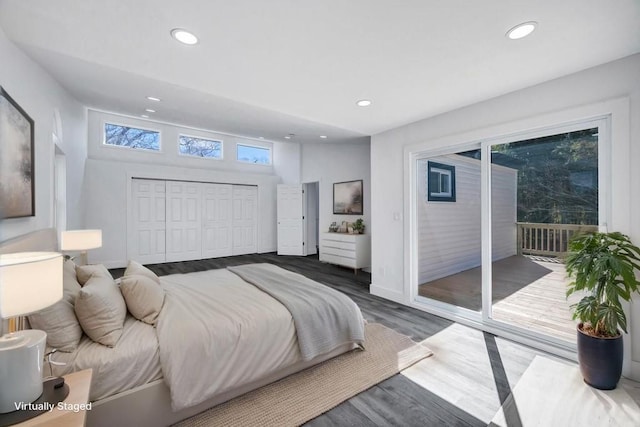 bedroom with access to outside, a closet, recessed lighting, and wood finished floors