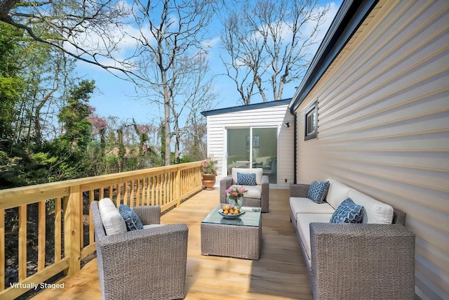 wooden deck with an outdoor living space