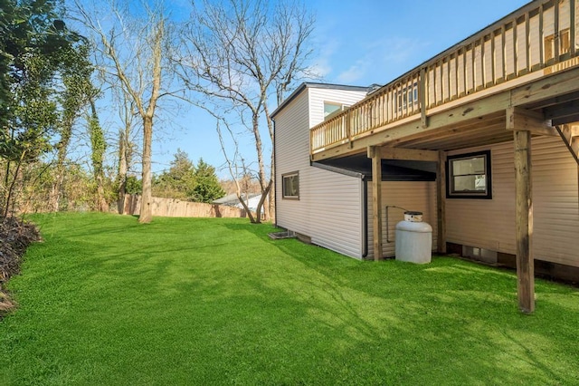 view of yard with fence and a deck