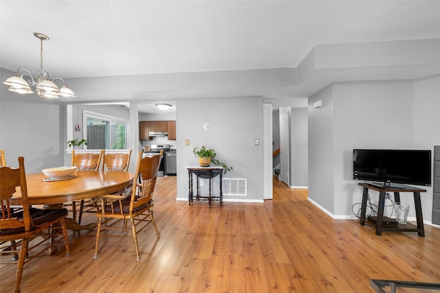 2816 Whispering Hls, Chester, NY 10918 - dining space featuring light wood-type flooring, a chandelier, baseboards, and stairs