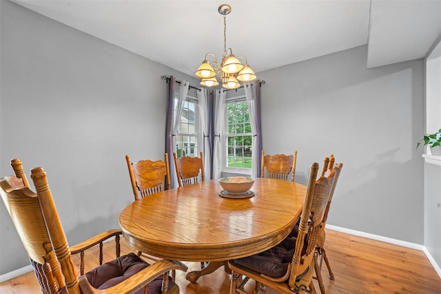 2816 Whispering Hls, Chester, NY 10918 - dining room featuring a chandelier, baseboards, and light wood-style flooring