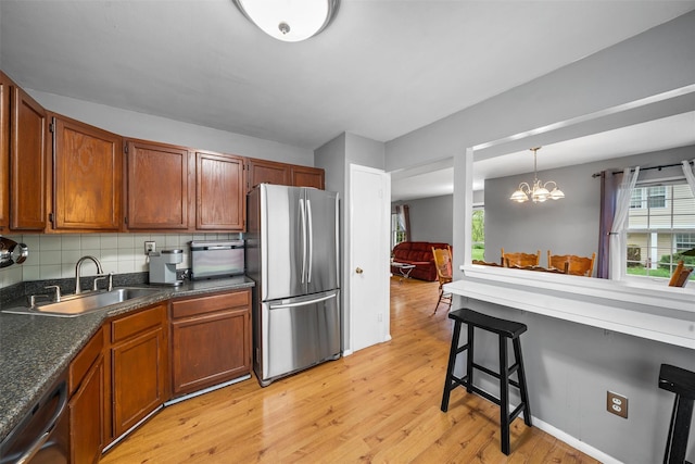 2816 Whispering Hls, Chester, NY 10918 - kitchen with freestanding refrigerator, a sink, light wood finished floors, and plenty of natural light