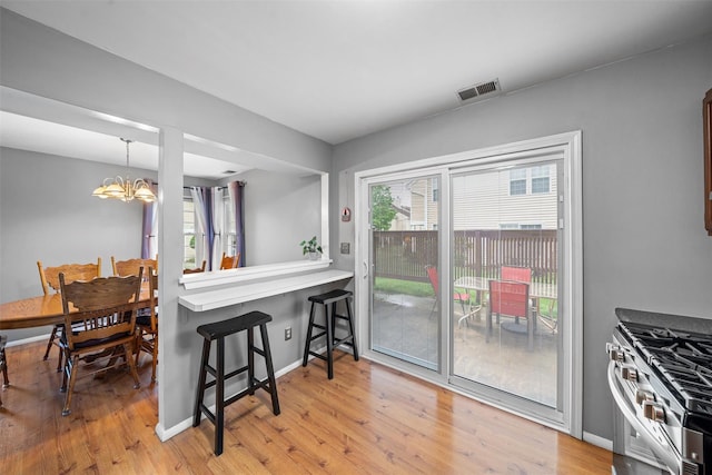 2816 Whispering Hls, Chester, NY 10918 - dining room with a chandelier and light wood-type flooring