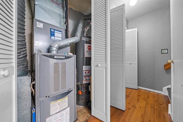 2816 Whispering Hls, Chester, NY 10918 - utility room featuring heating unit and gas water heater