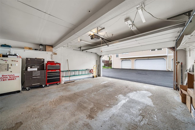 2816 Whispering Hls, Chester, NY 10918 - garage with a garage door opener and freestanding refrigerator