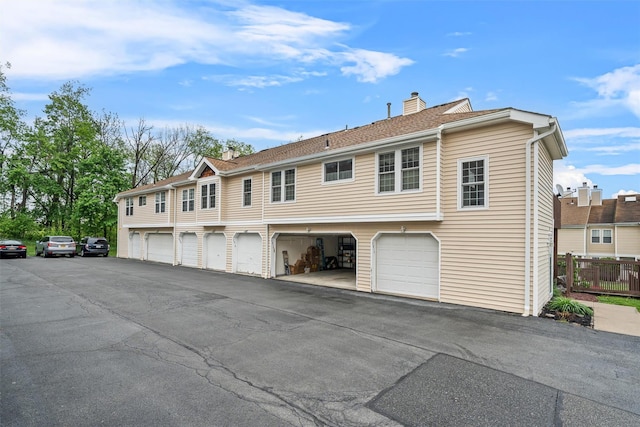 2816 Whispering Hls, Chester, NY 10918 - back of house featuring a chimney and fence